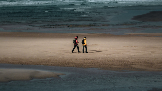 walking_beach_conversation_pair_unsplash